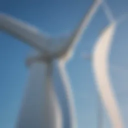 A close-up view of wind turbine blades against a clear blue sky