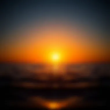 A tranquil sunset over a calm sea, representing the transition from day to night.